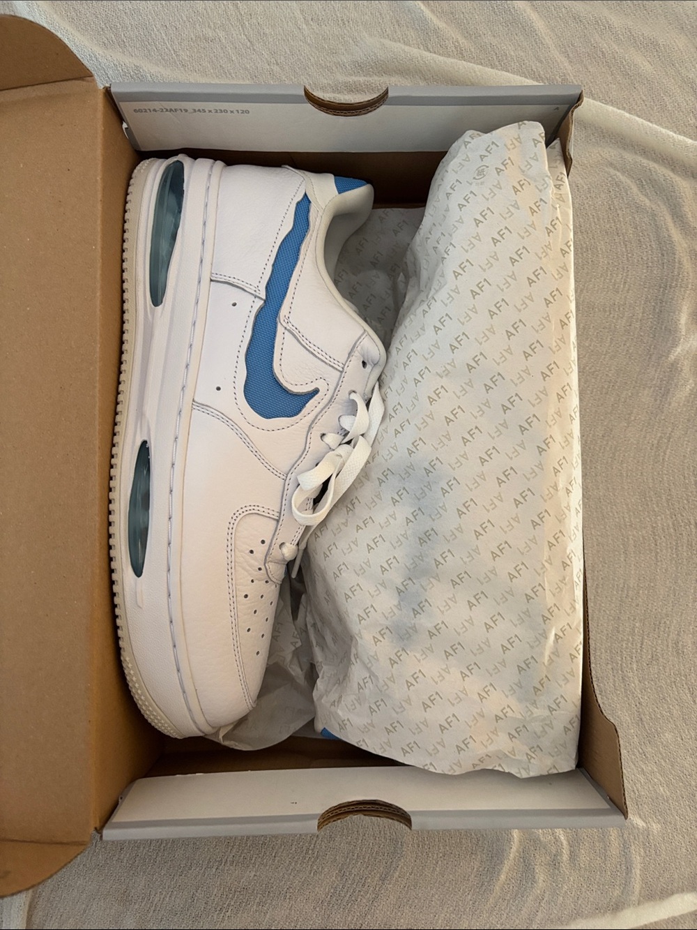 Nike Men’s Air Force 1 Low Evo White Sneakers with Blue Swoosh